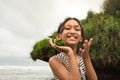 Skinny Southeast Asian teen girl having fun on the beach Royalty Free Stock Photo