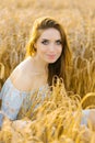 Portrait of a Slavic girl with red hair sitting in a field Royalty Free Stock Photo