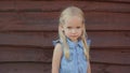 Portrait of a Slavic two-year-old girl in the village. Royalty Free Stock Photo