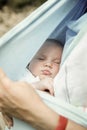 Portrait of a sleeping baby boy, resting in mothers arms Royalty Free Stock Photo