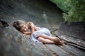 Portrait of sleeping little girl in forest