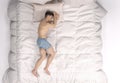 3D Render : The portrait of sleeping male character in the big white bed