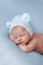 Portrait of sleeping newborn baby boy in bear hat with ears. Royalty Free Stock Photo