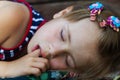 Portrait of sleeping pretty child girl who sucks her finger while sleeping. Royalty Free Stock Photo