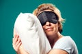 A portrait of sleeping woman with sleep mask on head. Relaxing time Royalty Free Stock Photo