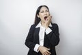 Portrait of sleepy attractive Asian woman wearing a black suit, feeling tired after overtime at work, yawning, covering opened Royalty Free Stock Photo