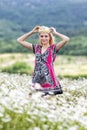 Portrait of slim girl in light dress in chamomile field Royalty Free Stock Photo