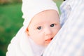 Portrait of a small baby looking at the camera with his big blue eyes, in the rays of the setting sun Royalty Free Stock Photo