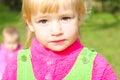 Portrait small girl on green herb Royalty Free Stock Photo
