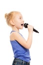 Portrait of small girl singing in microphone