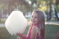 Portrait of small girl with sweet cotton candy Royalty Free Stock Photo