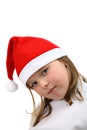 Portrait of small girl wearing Santa Claus cap, wi Royalty Free Stock Photo