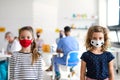 Portrait of small girls with face mask, coronavirus, covid-19 and vaccination concept. Royalty Free Stock Photo