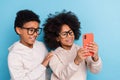 Portrait of small little friends friendship trendy cheery pre-teen kids taking selfie  over bright blue color Royalty Free Stock Photo