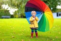 Portrait of small preschooler girl with colorful umbrella Royalty Free Stock Photo