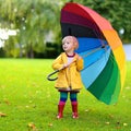 Portrait of small preschooler girl with colorful umbrella Royalty Free Stock Photo