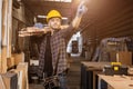 portrait smart builder wood male furniture maker, sawmill worker professional standing strong and confident carrying wooden planks Royalty Free Stock Photo