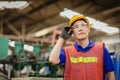 Portrait of smart engineer Asian Chinese happy labor worker handsome model in heavy industry background.hand at protection