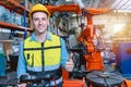 Portrait smart engineer man working with advance robotic machine weling in heavy industry