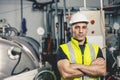 Portrait smart european engineer worker smiling looking for the future in a heavy industrial factory