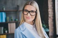 Portrait of smart investor banker chief lady have specs good look in loft workspace wear blazer jacket