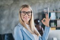 Portrait of smart investor leader lady demonstrate good promo choice product show okey symbol in workspace