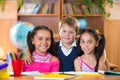 Portrait of smart schoolchildren in classroom