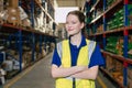 Portrait smart worker confident young teen female work inside warehouse industry inventory management happy smiling