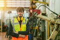 portrait smart young american engineer caucasion male work with automation machinery operator confident arm crossed Royalty Free Stock Photo