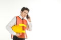 Portrait of smart young asian engineer businessman wearing white shirt and safety vest and helmet holding and talking smart mobile Royalty Free Stock Photo