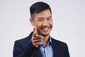 Portrait, smile and Asian man pointing at you for choice, business decision and face isolated in studio. Direction Royalty Free Stock Photo