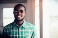 Portrait of smile bearded African man wearing sunglasses Royalty Free Stock Photo