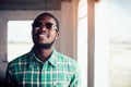 Portrait of smile bearded African man wearing sunglasses Royalty Free Stock Photo