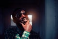 Portrait of smile bearded African man wearing sunglasses.Low key style Royalty Free Stock Photo