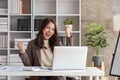 Portrait smile beautiful business asian woman pink suit working office desk computer. Small business sme people employee Royalty Free Stock Photo