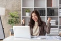 Portrait smile beautiful business asian woman pink suit working office desk computer. Small business sme people employee Royalty Free Stock Photo