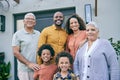 Portrait, smile and big family by home, interracial and having fun together at backyard. Face, grandparents and children Royalty Free Stock Photo