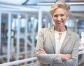 Portrait, smile and business woman with arms crossed in office with pride for career, job or occupation. Ceo, senior Royalty Free Stock Photo