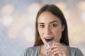 Portrait of a smile happy young woman eating chocolate bar Royalty Free Stock Photo
