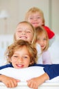 Portrait, smile or love with brother and sister sibling children on a bed in their home together. Family, happy or Royalty Free Stock Photo