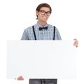 Portrait, smile and man with board for mockup in studio isolated on a white background. Poster, glasses and happy, funny Royalty Free Stock Photo