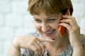 Portrait smile of a middle-aged woman talking on the phone Royalty Free Stock Photo