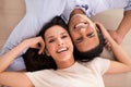 Portrait, smile and top view of couple holding hands on floor to relax together in home. Above, man and face of happy Royalty Free Stock Photo