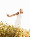 Portrait, smile and woman in field with flowers in the countryside in summer. Happy person in hat, nature and wheat farm Royalty Free Stock Photo