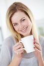 Portrait, smile and woman relax with coffee in a kitchen, calm and content in her home. Happy, face and female drinking Royalty Free Stock Photo