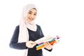 Portrait of smiley beautiful young muslim woman student wearing Hijab holding colorful book on white background, Education exam Royalty Free Stock Photo