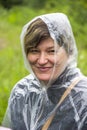 Portrait of smiley woman in raincoat