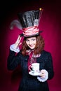 Portrait of smilimg young woman in the similitude of the Hatter Royalty Free Stock Photo