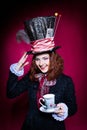 Portrait of smilimg young woman in the similitude of the Hatter Royalty Free Stock Photo