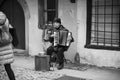 Portrait of smiling accordionist playing in the street